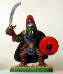 eM-4  plastic Orc Leader

I cut and rotated his left arm to bring his shield forward.

The helmet, plume, and cloak are all made from putty.